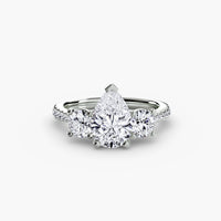Three-Stone with Pavé Band ring setting in 14k white gold with pear center stone
