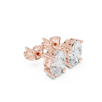 Oval cut diamond stud earring with push-back closure in 14k rose gold