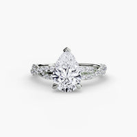 The Twisted Pavé Solitaire ring setting in 14k white gold with pear center stone
